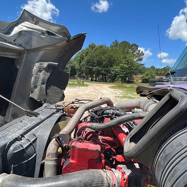 Tractor Trailer with hood up doing DPF and Regen Diagnostics