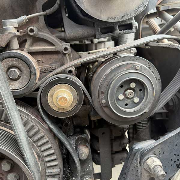Picture of a serpentine belt needing to be replaced on a diesel