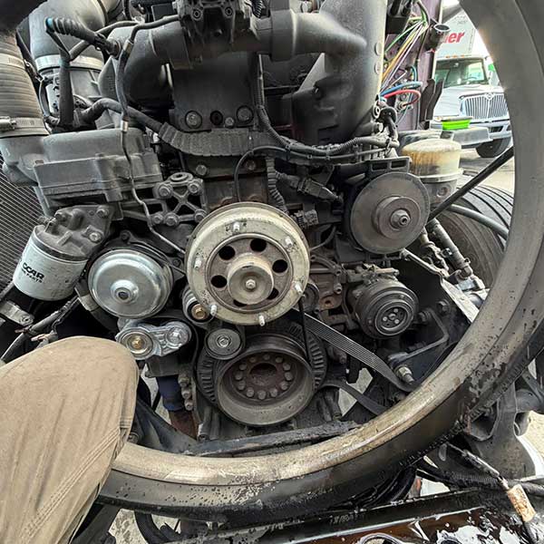 Picture of a emergency roadside repair on a diesel truck has a broken bolt in block we drilled an tapped engine block