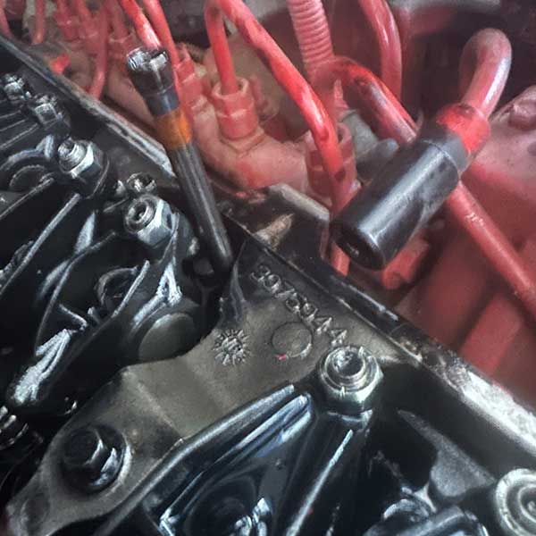 Picture of a bent push rod on a diesel truck emergency repair