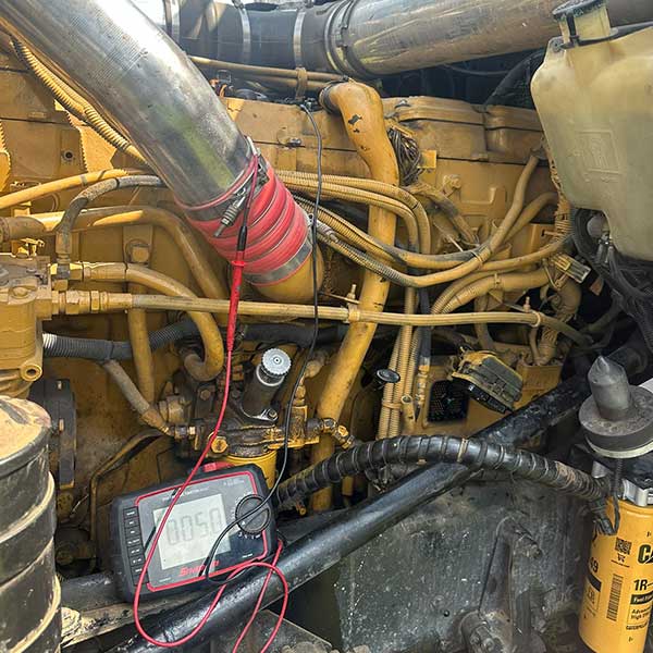 Picture of a wiring harness on a piece of heavy equipment troubleshooting diagnostics and emergency job site repair